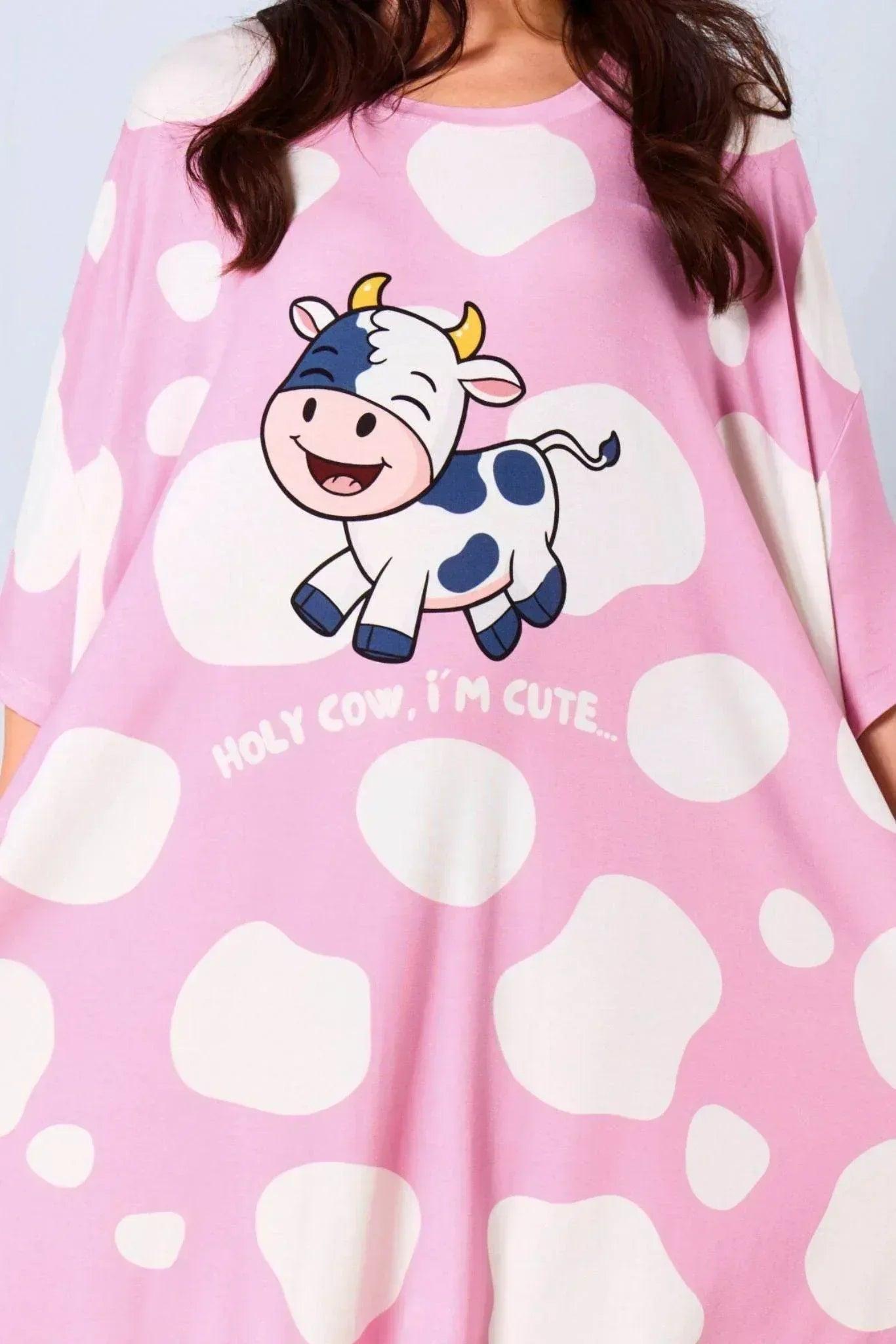 Close up of Pink Sleep Tee with cow print and 'HOLY COW, I'M CUTE' text
