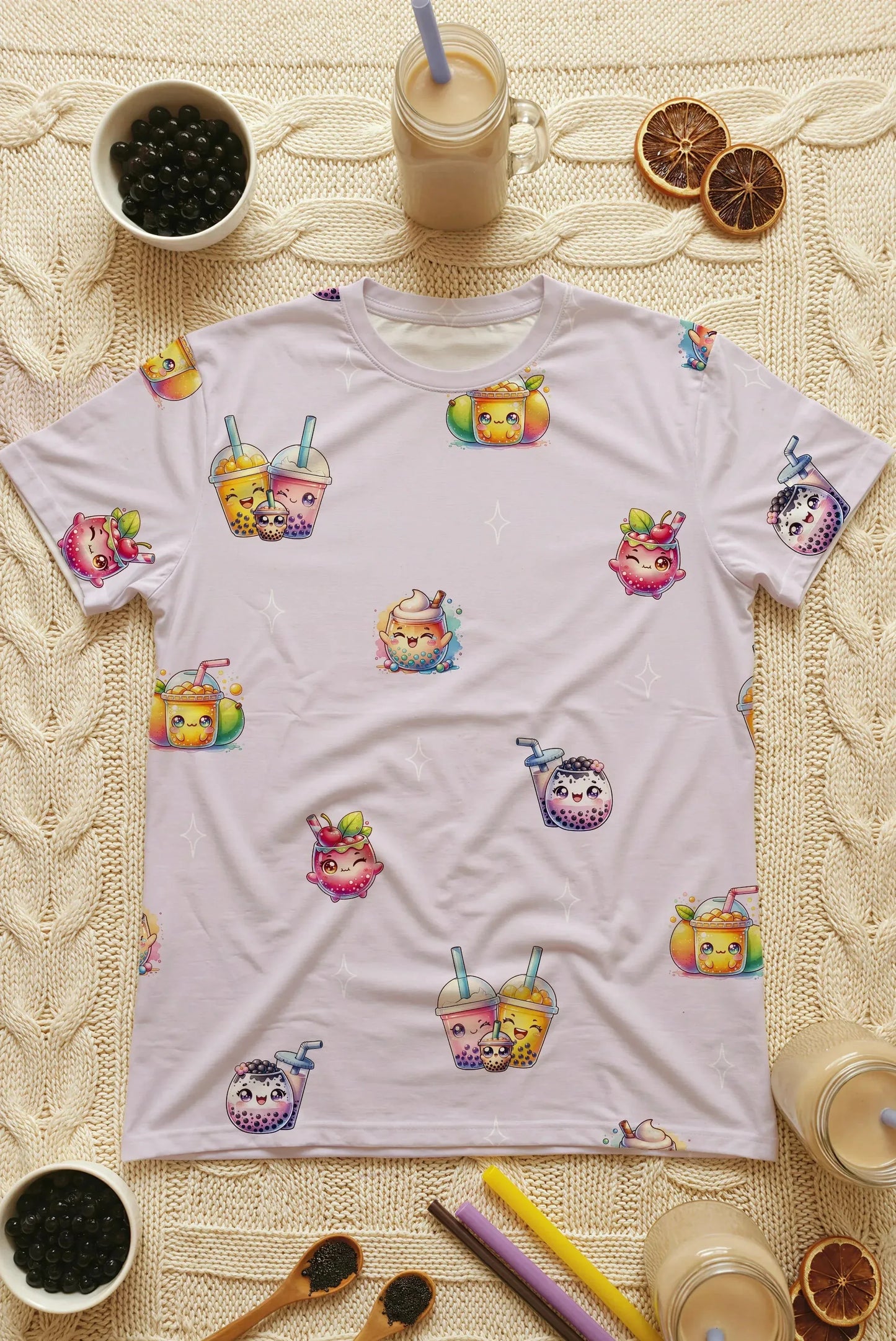 Flat lay photography of the kids' oversized bamboo sleep tee surrounded by bubble tea ingredients, pearls, and straws. Close-up of the premium fabric and vibrant boba character print on this Singapore sleepwear essential.