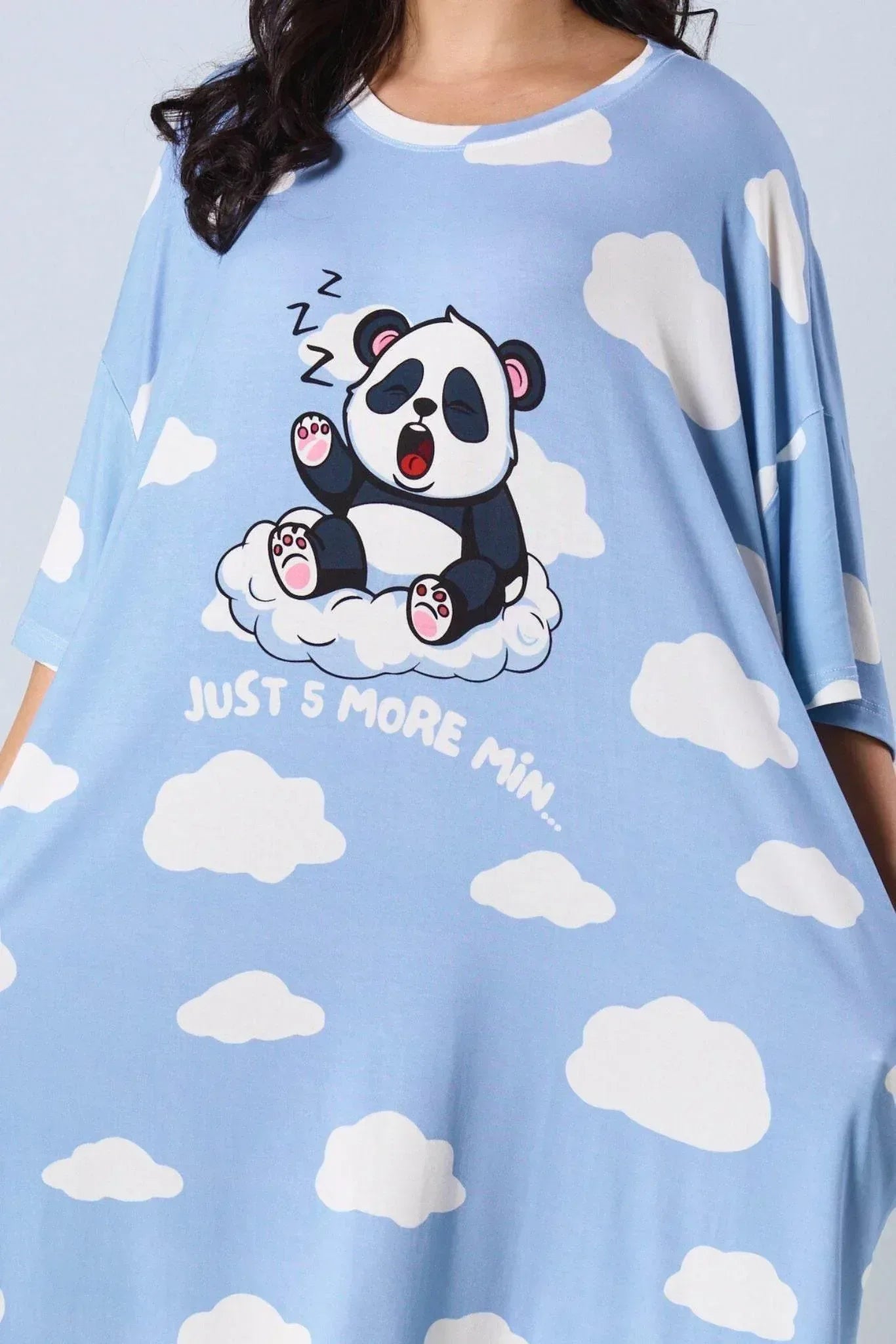 Light blue sleep tee with panda and cloud patterns on a plain background