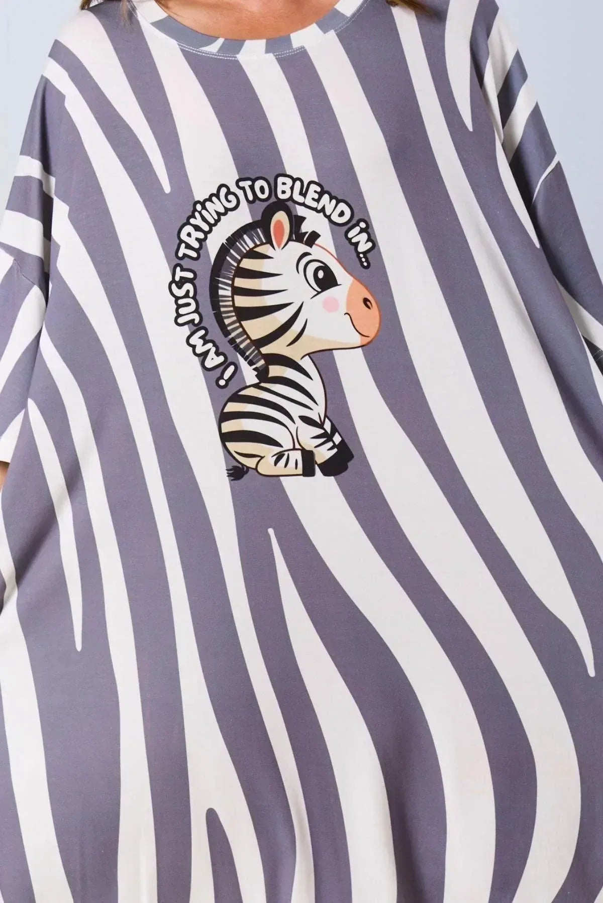 Zebra-themed shirt with a zebra graphic and text on a striped background