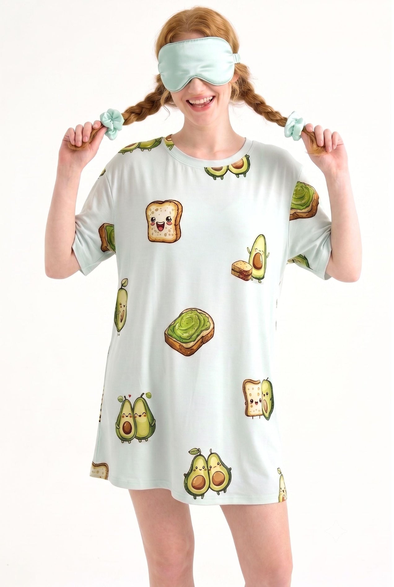 Woman wearing an Avo-Good Night mint sleep mask over her eyes with matching avocado toast print sleep tee