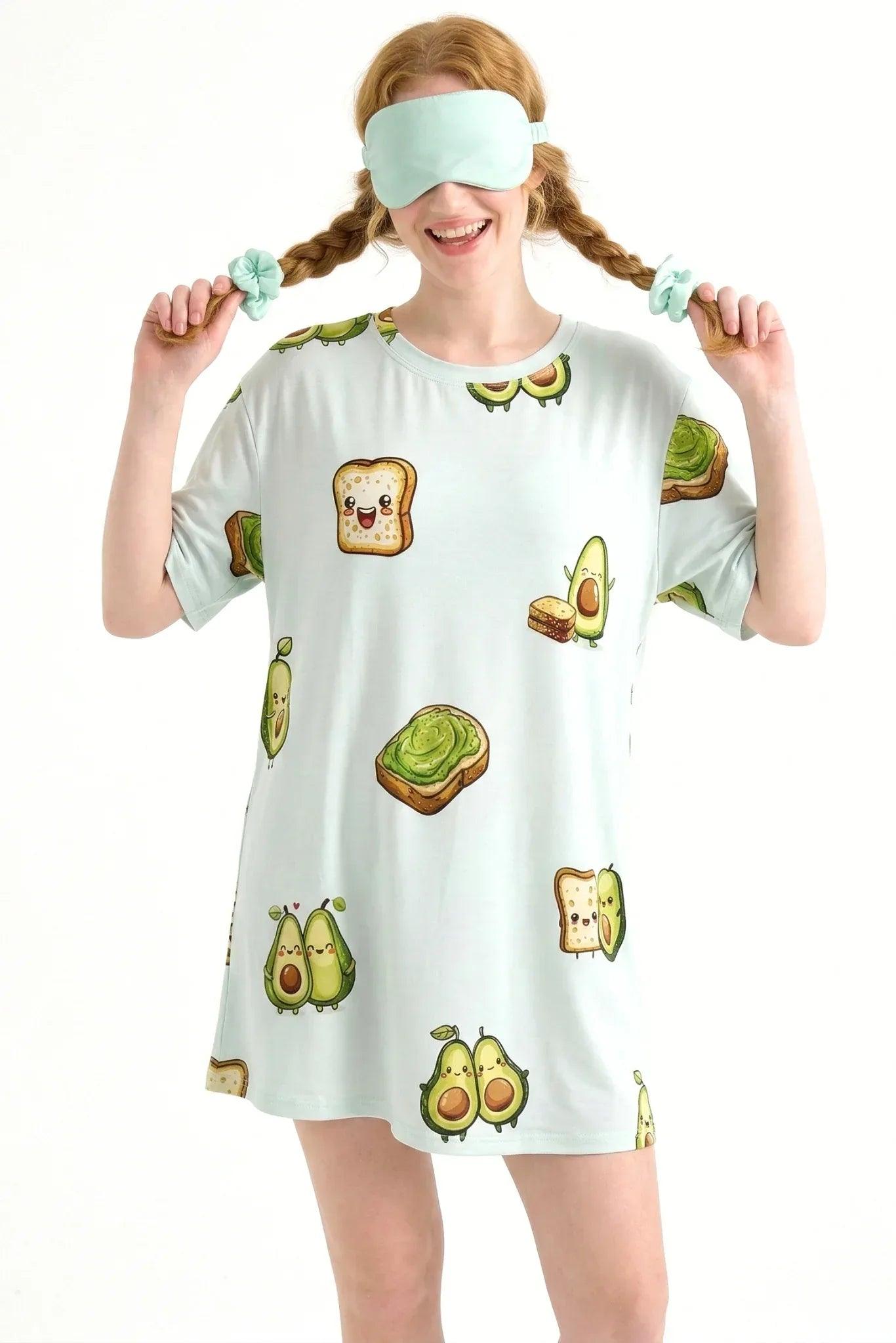 Smiling woman wearing the Avo-Good Night Petite bamboo sleepwear and a matching light green, hypoallergenic sleep mask over her eyes.