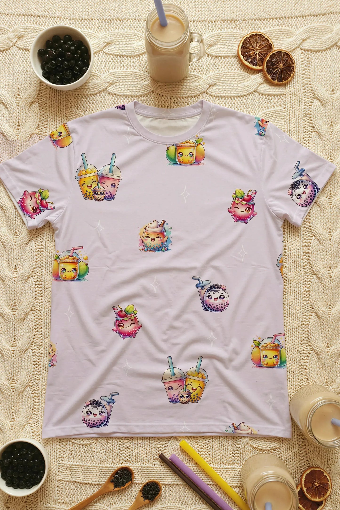 A flat lay arrangement of the oversized bamboo sleep tee surrounded by bubble tea ingredients like tapioca pearls, straws, and milk tea. Highlighting the soft texture and vibrant print of this premium Singapore sleepwear.