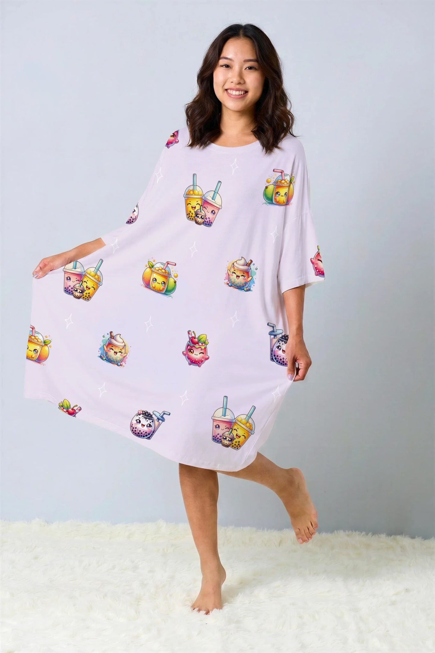 Woman displaying the wide, comfortable fit of a purple oversized bamboo sleep tee with a cute bubble tea pattern. Breathable sleepwear perfect for the Singapore climate.