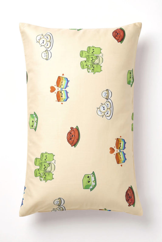 Kueh-zy Medley bamboo pillowcase in cream kueh print, flat lay on white