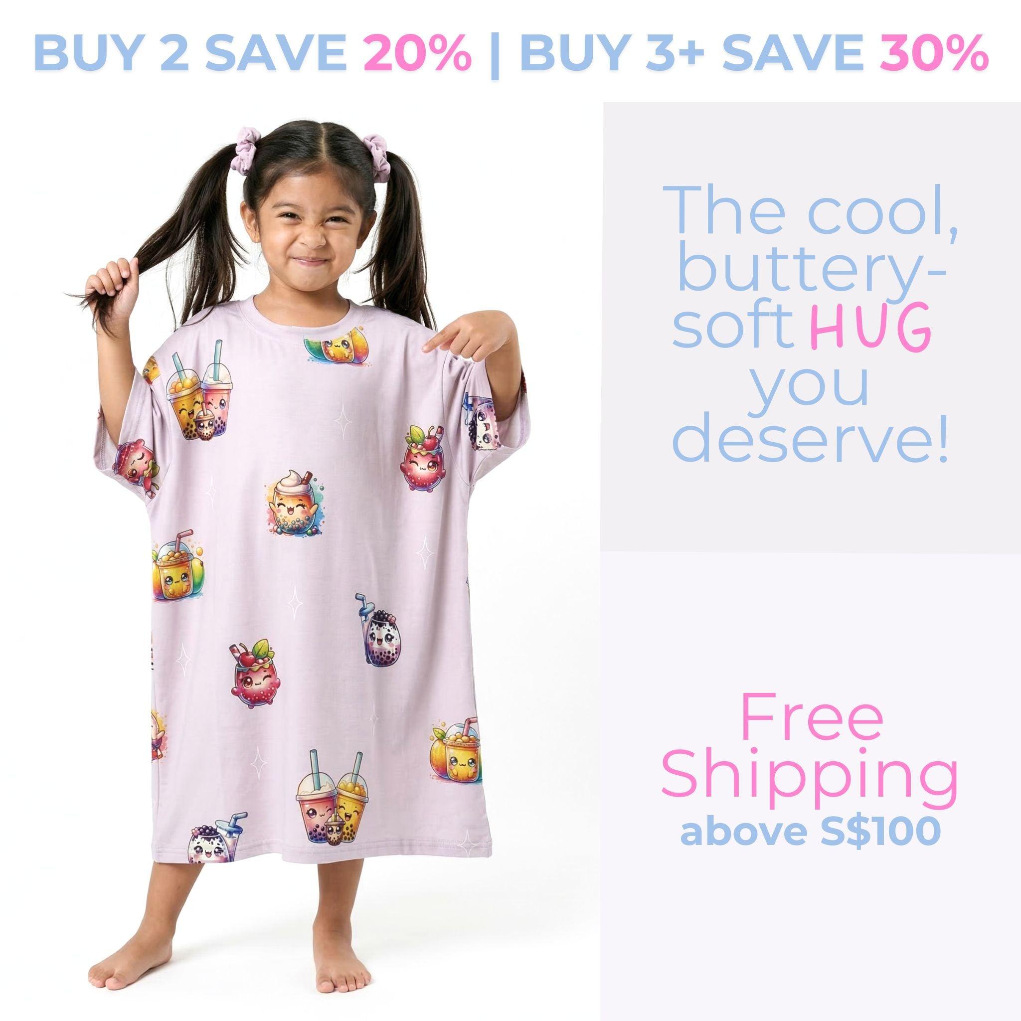 A promotional graphic featuring a smiling young girl with pigtails standing barefoot and hugging a large white stuffed cat. She is wearing a kids' light pink sleep tee with a cat and paw print pattern that reads "Press Paws & Snooze." Text on the image reads "BUY 2 SAVE 20% | BUY 3+ SAVE 30%", "The cool, buttery-soft HUG you deserve!", and "Free Shipping above S$100", with an orange button that says "CLAIM MY HUG".