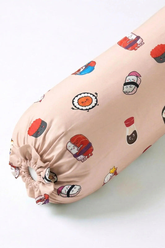 A close-up angled view of the Soy Cozy bolster cover featuring adorable sushi and soy sauce bottle characters on a soft beige background.