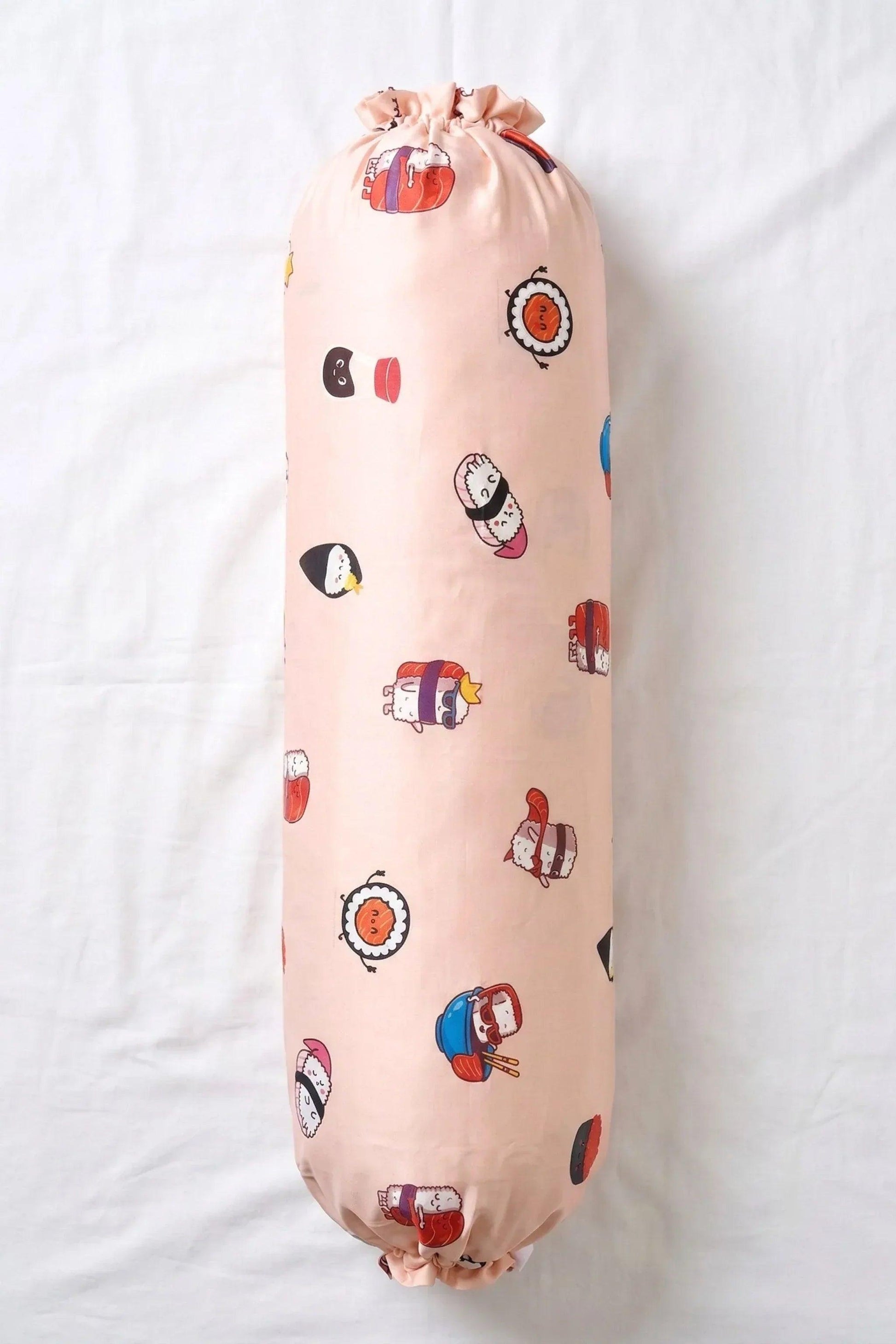 A full-length, top-down view of the Soy Cozy sushi print bolster pillowcase showing the repeated pattern of cute nigiri and hand rolls.