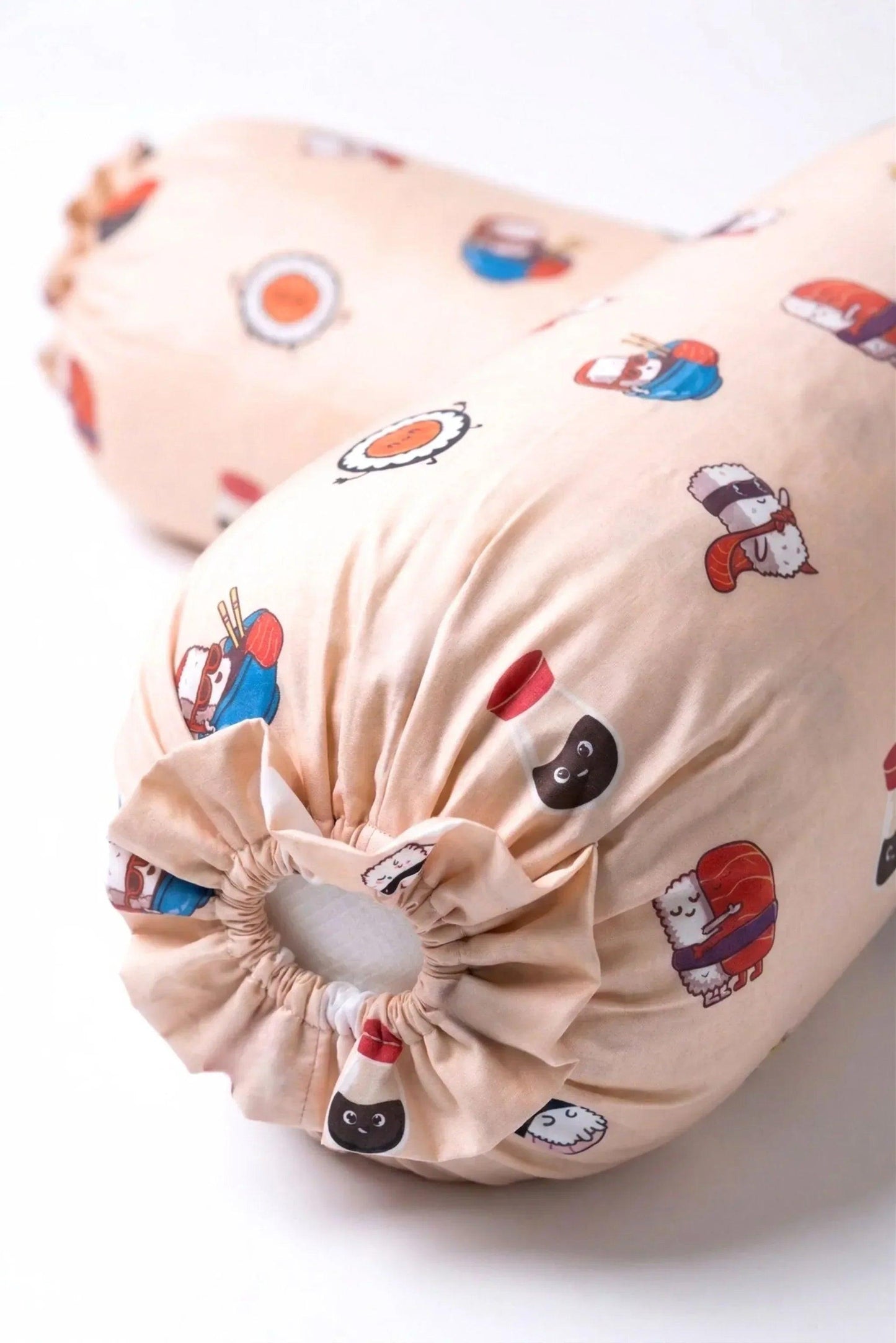 A detailed shot of the gathered drawstring end on the Soy Cozy sushi print bolster cover, highlighting the playful food-themed design.