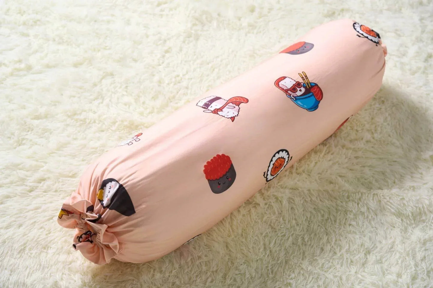 Decorative bolster with sushi cartoon character designs on a light background