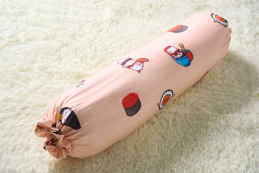 Decorative bolster with sushi cartoon character designs on a light background