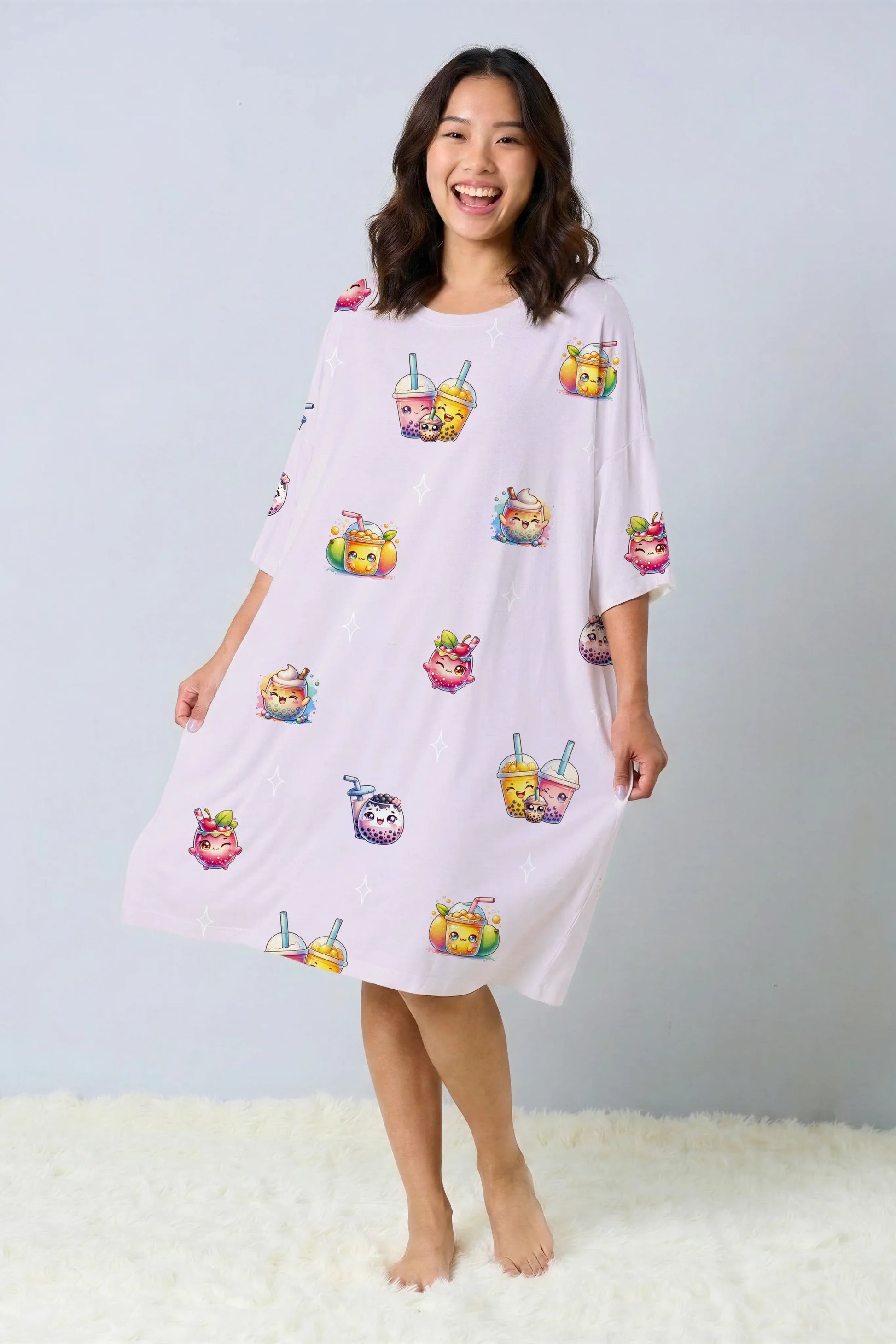 Front view of a model wearing a kawaii boba tea print oversized bamboo sleep tee. Soft, pastel purple sleepwear dress standing on a white fur rug.