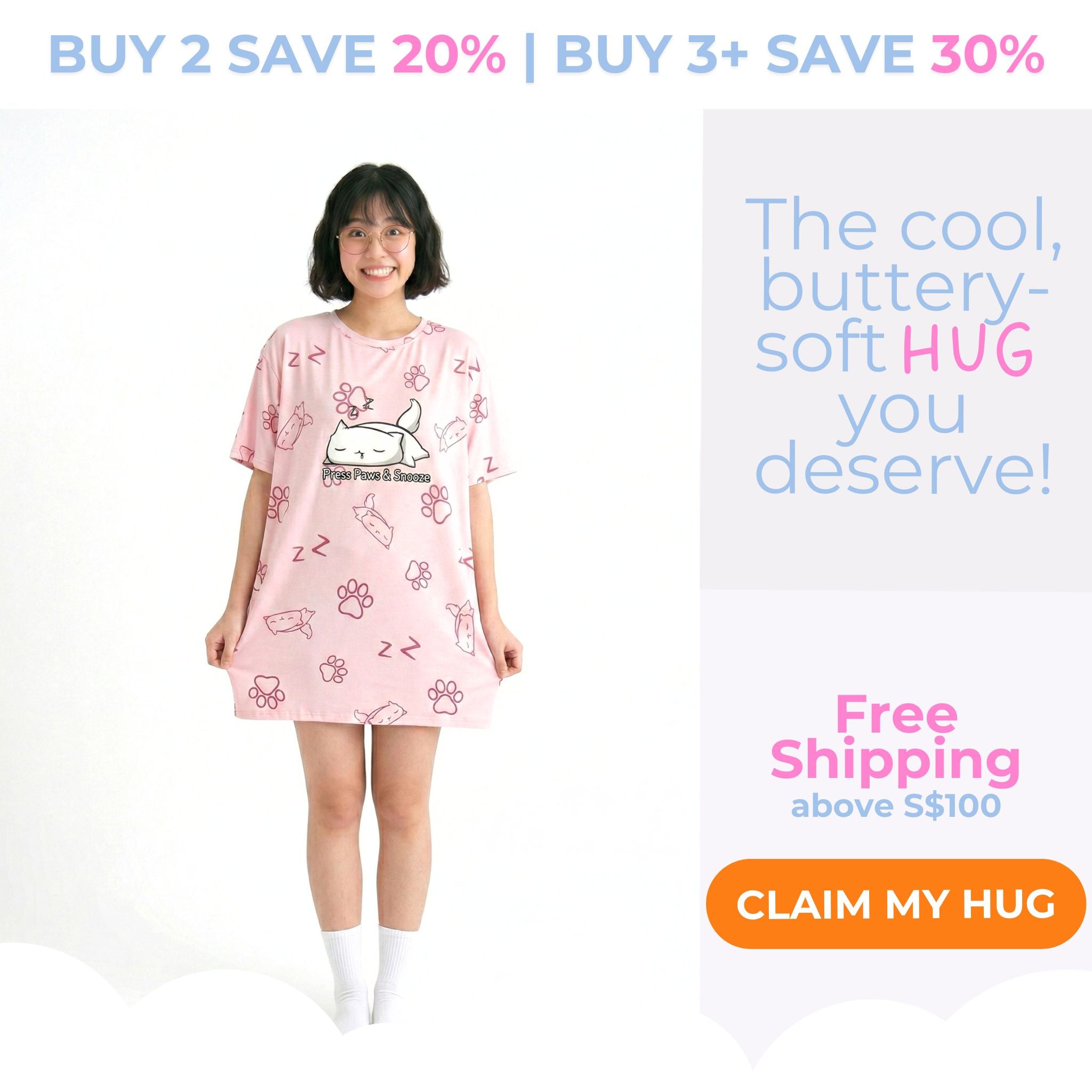 A promotional graphic featuring a smiling young woman standing and playfully holding the hem of her light pink, oversized sleep tee. The tee features a cute cat and paw print pattern with the words "Press Paws & Snooze." She is wearing fluffy white socks. Text on the image reads "BUY 2 SAVE 20% | BUY 3+ SAVE 30%", "The cool, buttery-soft HUG you deserve!", and "Free Shipping above S$100", with an orange button that says "CLAIM MY HUG".