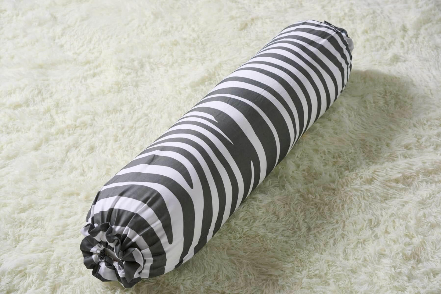 Black and white zebra striped bolster 
