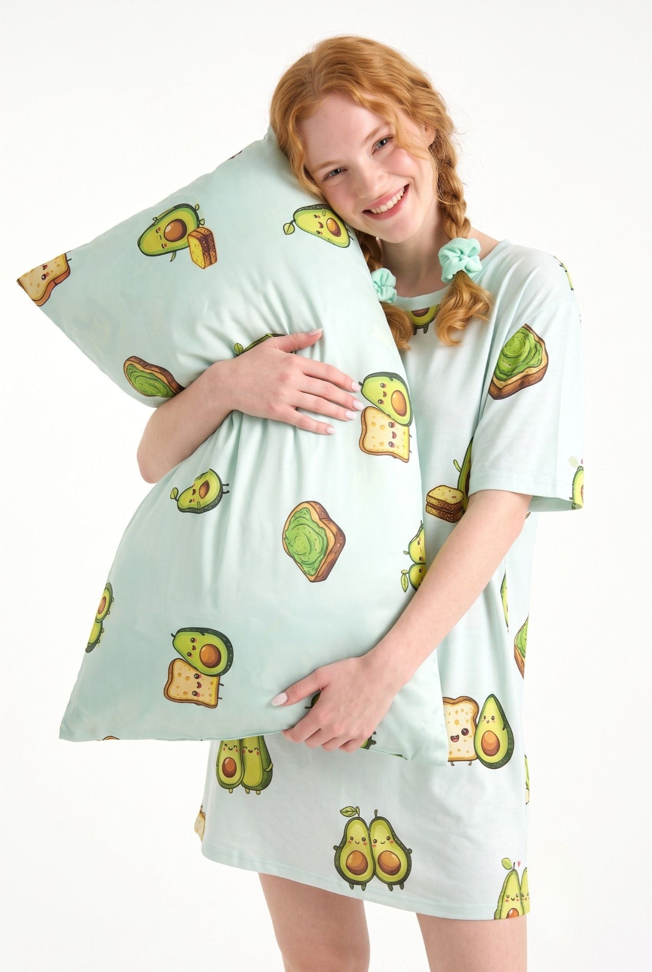 Woman smiling hugging an Avo-Good Night mint avocado toast print bamboo pillow in a matching sleep tee