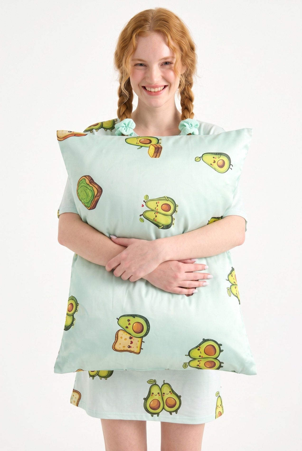 Woman in Avo-Good Night mint avocado toast print sleep tee hugging a matching bamboo pillow