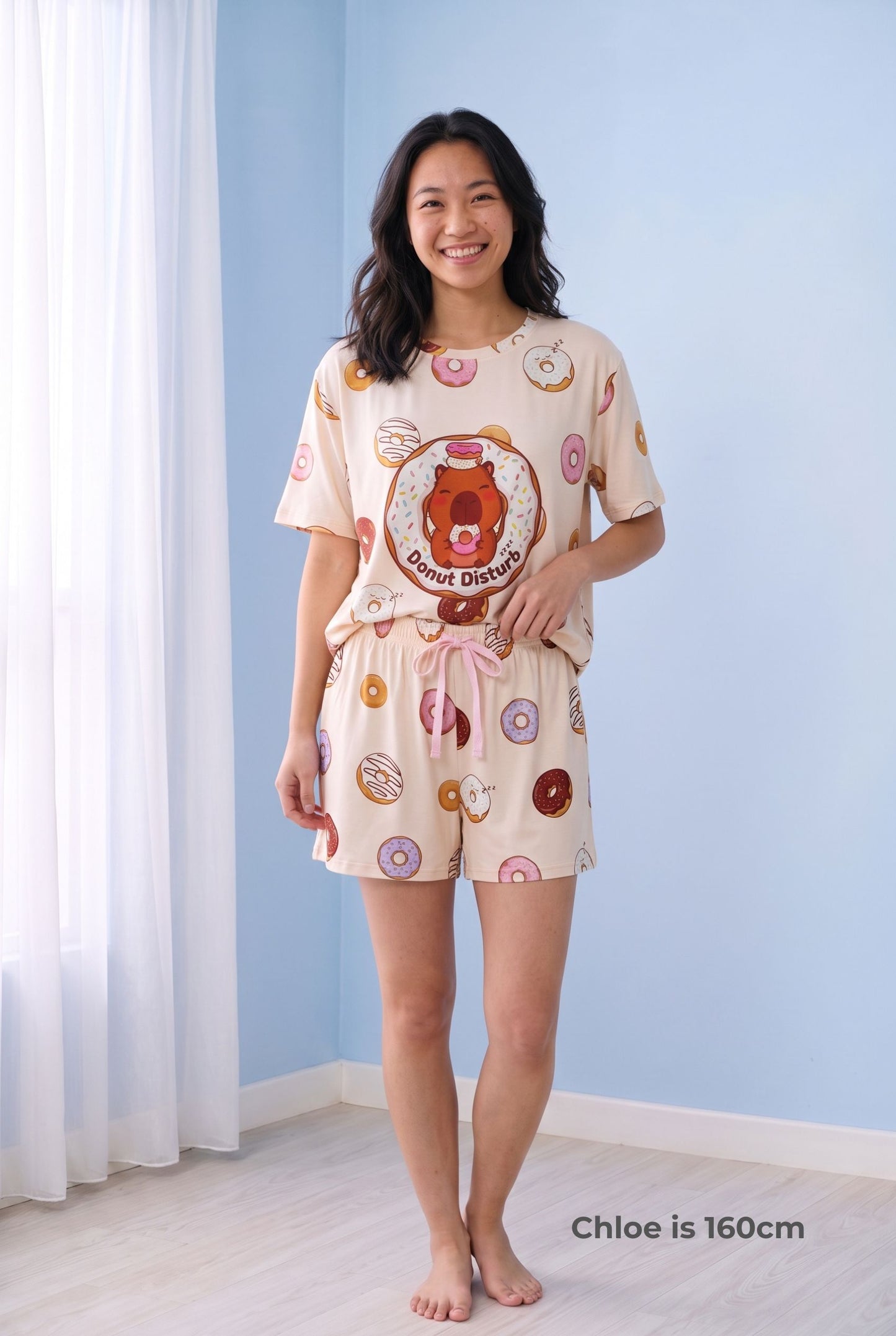 Woman wearing the Donut Disturb Comfort Fit bamboo shorts with the matching Petite sleep tee, showing the full set on a 160cm model.