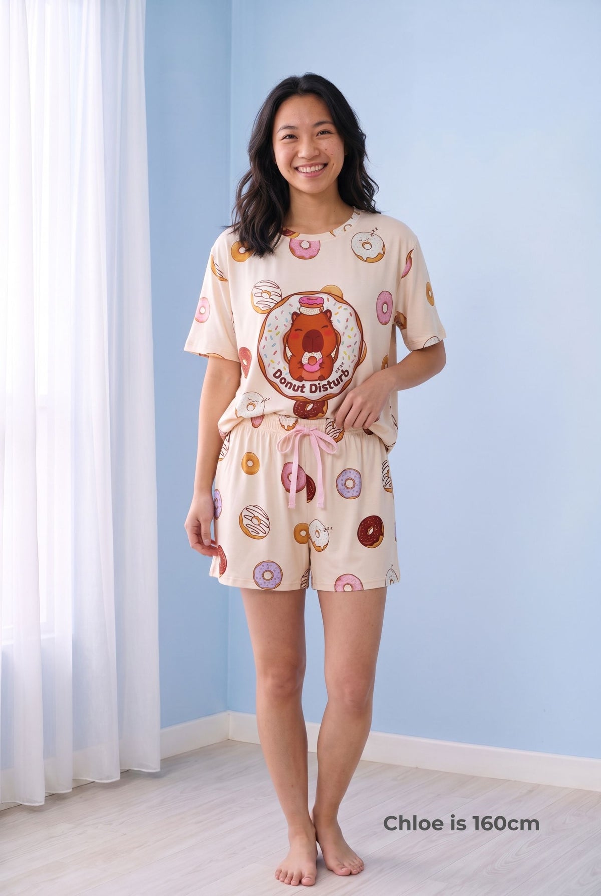 Woman wearing the Donut Disturb Comfort Fit bamboo shorts with the matching Petite sleep tee, showing the full set on a 160cm model.