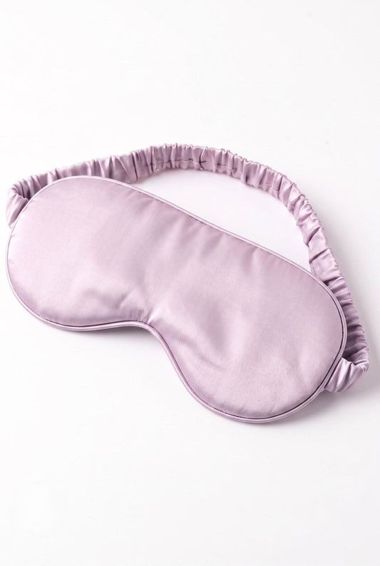 The Bubble Tee sleep mask in solid lilac with elastic band, flat lay on white