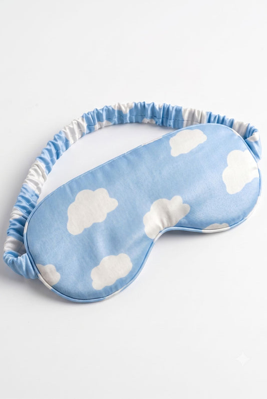 Un-bear-ably Sleepy bamboo sleep mask in blue cloud print, flat lay on white