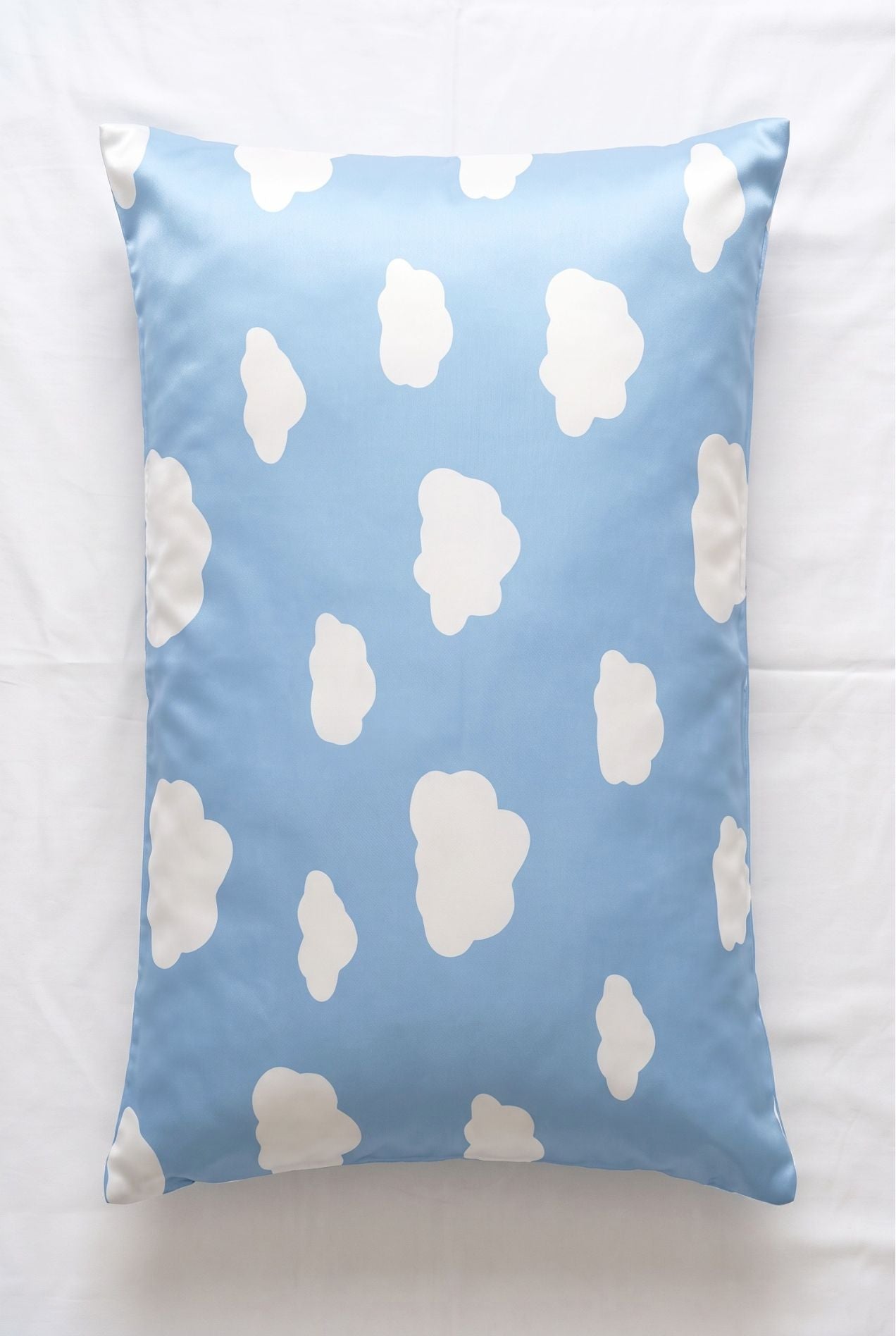 Un-bear-ably Sleepy bamboo pillowcase in blue cloud print, flat lay on white