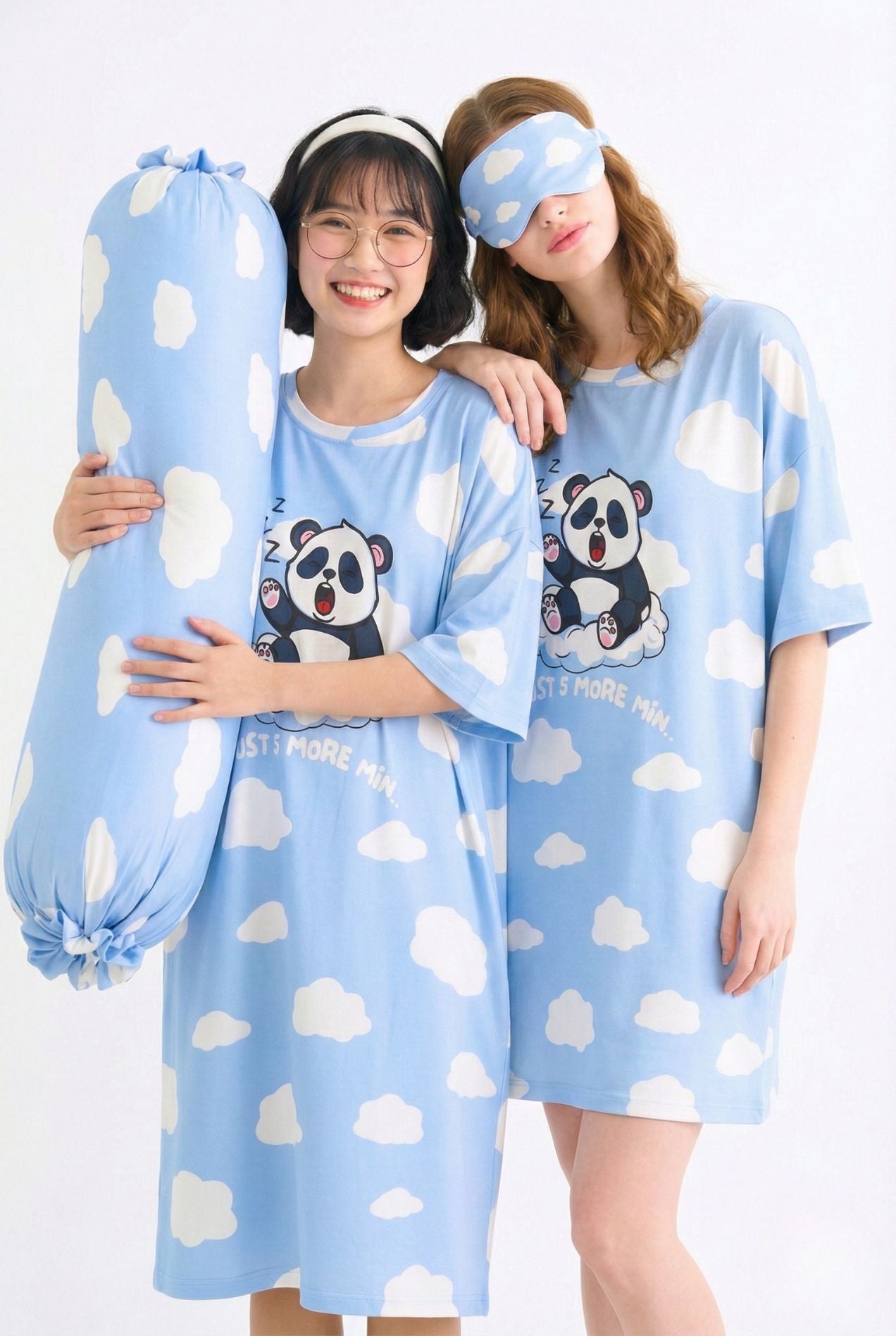 Two women in Un-bear-ably Sleepy cloud-print sleepwear, one wearing the matching bamboo sleep mask and holding a matching bamboo bolster